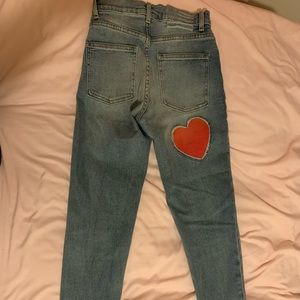 Light wash jeans with stitched heart